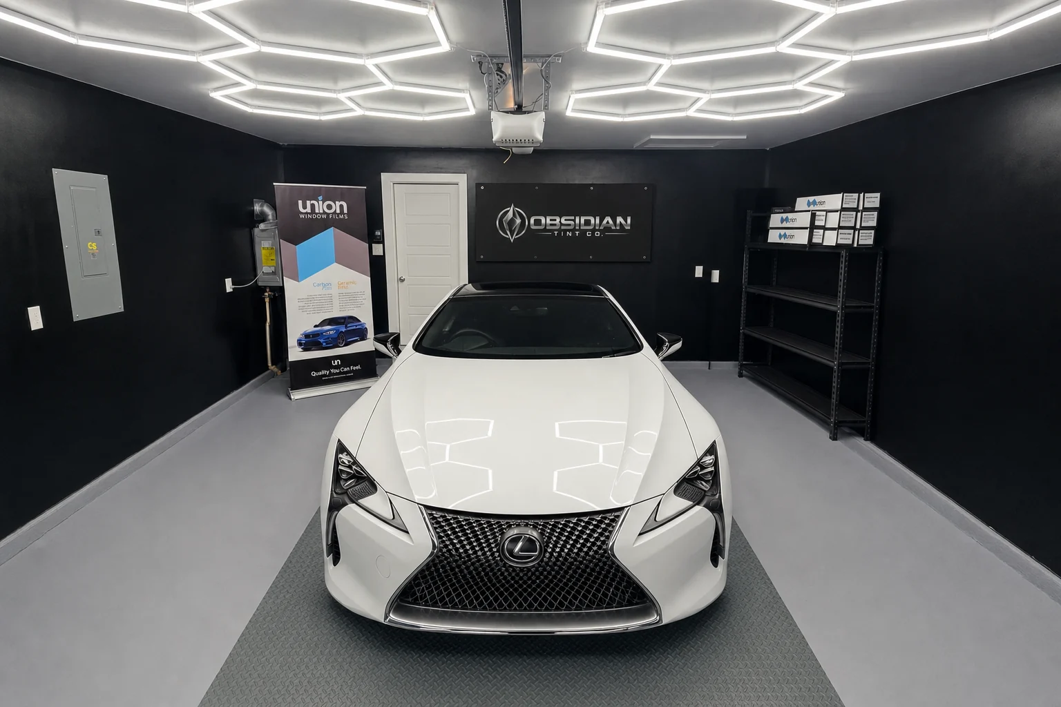 A white Lexus LC 500 with tinted windows, ready to hand back in the Obsidian Tint Co studio in Princeton, TX