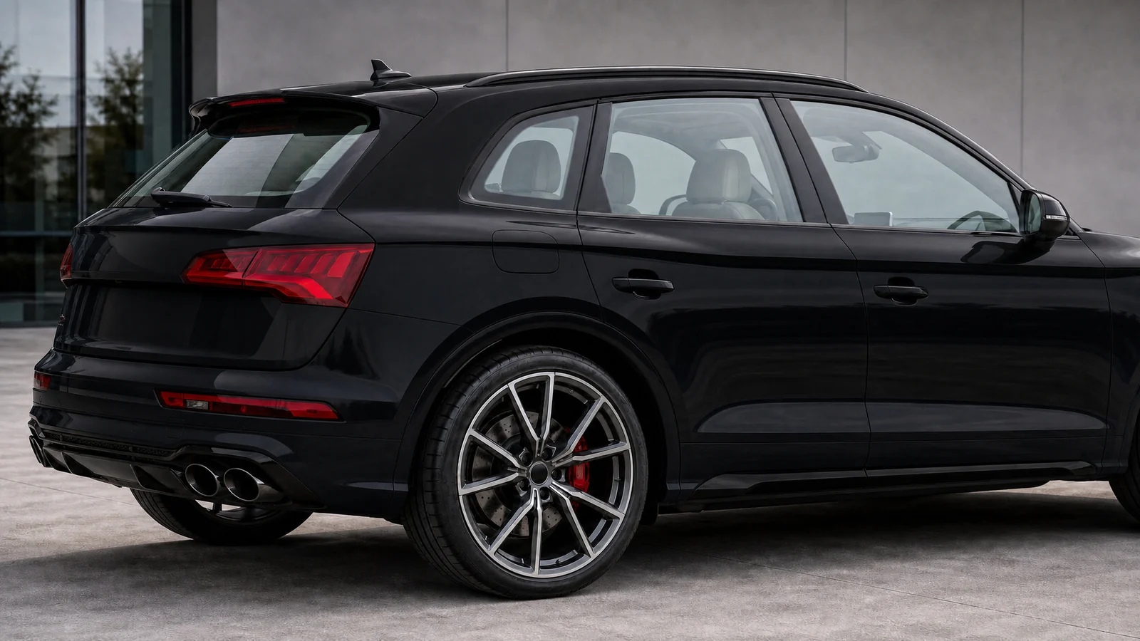 A black Audi SQ5 with clear glass
